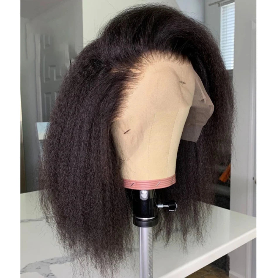 Mannequin head with a full lace wig on a white surface